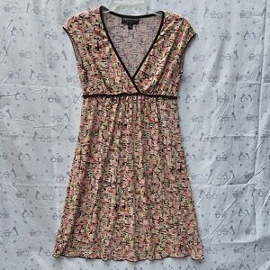 Connected Petite V-neck empire waist dress with a multi-color geometric print.